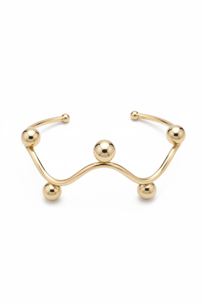 Brazalete rígido ondulado con diseños de esferas
